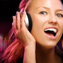 A woman wearing headphones, enjoying the music being played.